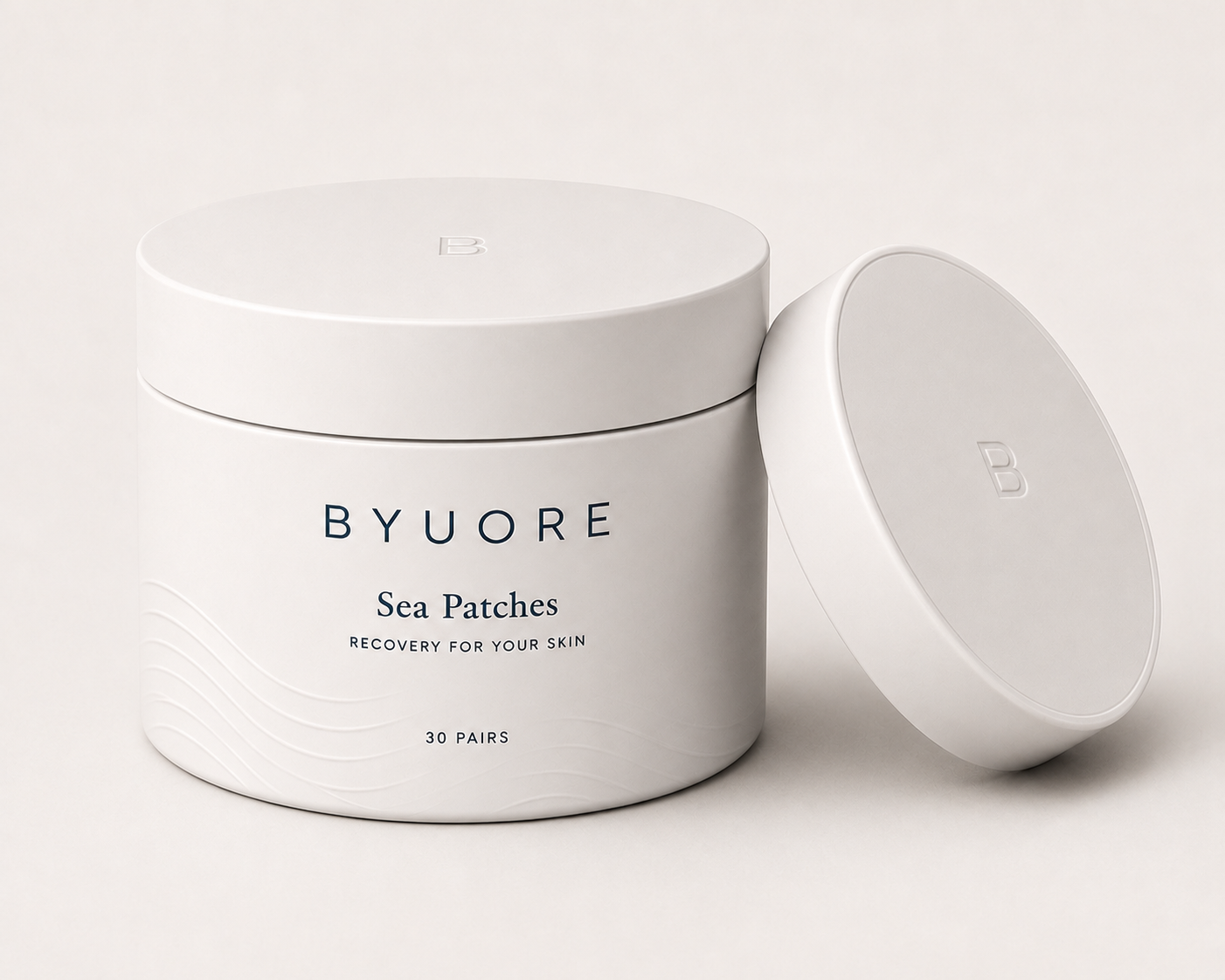 Ivory BYUORE Sea Patches jar with 30 pairs and lid leaning beside it